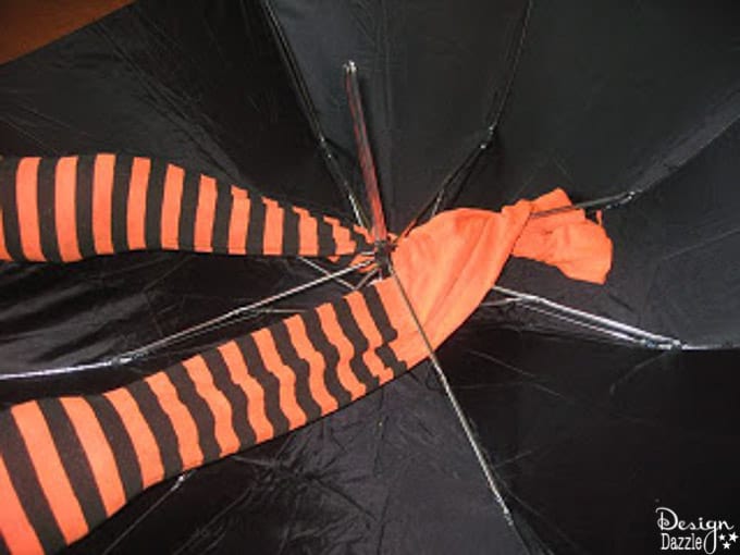 These adorable striped whimsical witch legs hang from the ceiling to make an adorable centerpiece for any Halloween Party! | Design Dazzle These adorable striped whimsical witch legs hang from the ceiling to make an adorable centerpiece for any Halloween Party! | Design Dazzle