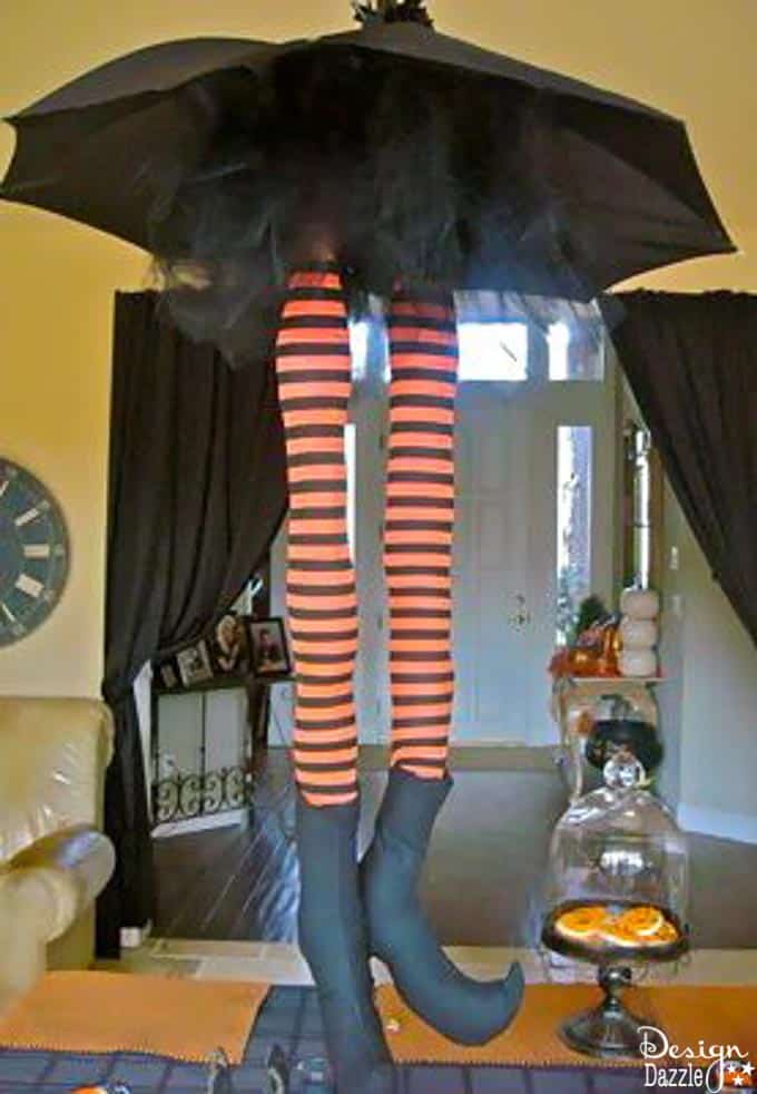 These adorable striped whimsical witch legs hang from the ceiling to make an adorable centerpiece for any Halloween Party! | Design Dazzle These adorable striped whimsical witch legs hang from the ceiling to make an adorable centerpiece for any Halloween Party! | Design Dazzle