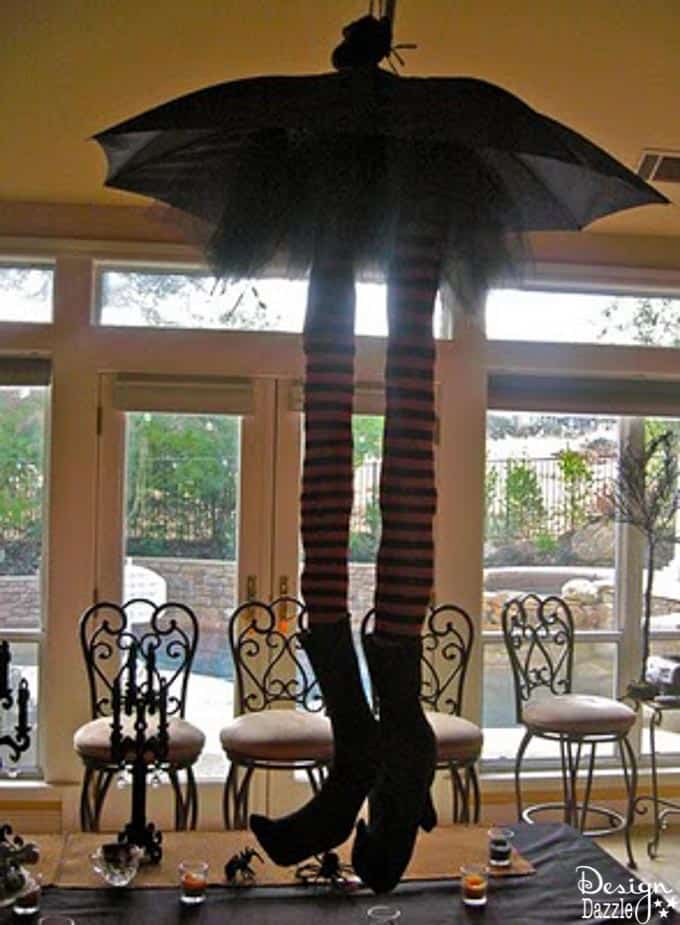 These adorable striped whimsical witch legs hang from the ceiling to make an adorable centerpiece for any Halloween Party! | Design Dazzle These adorable striped whimsical witch legs hang from the ceiling to make an adorable centerpiece for any Halloween Party! | Design Dazzle