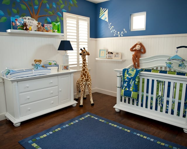 Adorable Monkey Business Nursery by Sue Vlautin of Red Geranium Interiors! Vibrant colors with cool wall murals and monkeys hanging from the ceiling!! 