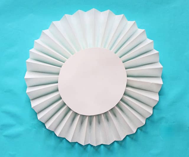 How to make extra-large rosettes out of paper window shades - Design Dazzle