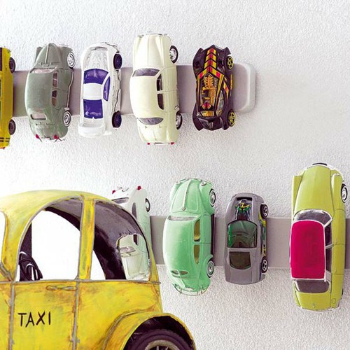 Magnetic strip toy car storage