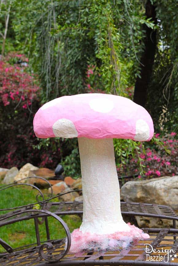Make a giant mushroom prop using an aluminum foil pan and newspaper - Design Dazzle #AliceinWonderland #partyprops