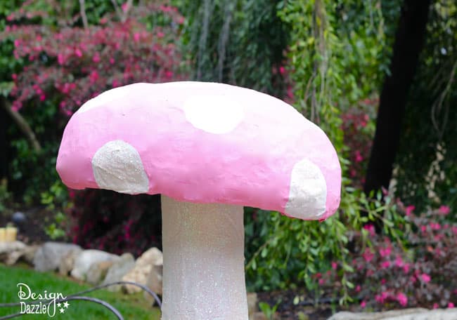 Make a giant mushroom with a foil roaster pan and paper mache - Design Dazzle #dollarstorecraft #partydecor #aliceinwonderland