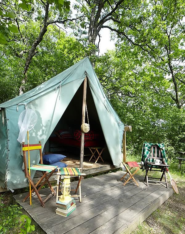 Use old scout tents to create a unique outdoor camping area