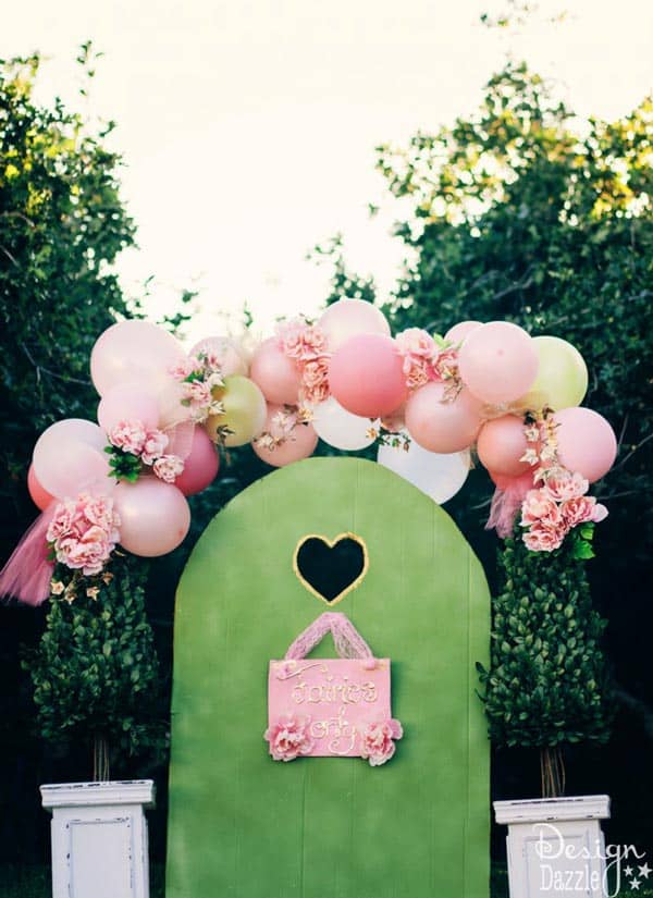 Fairy gate and sign are made out of cardboard! This fairy party cost less than $100 to create. There are lots of CREATIVE and AFFORDABLE DIY projects that can be easily recreated to make your own fairy party on a budget!! Design Dazzle #partyonadime #fairyparty #budgetparty