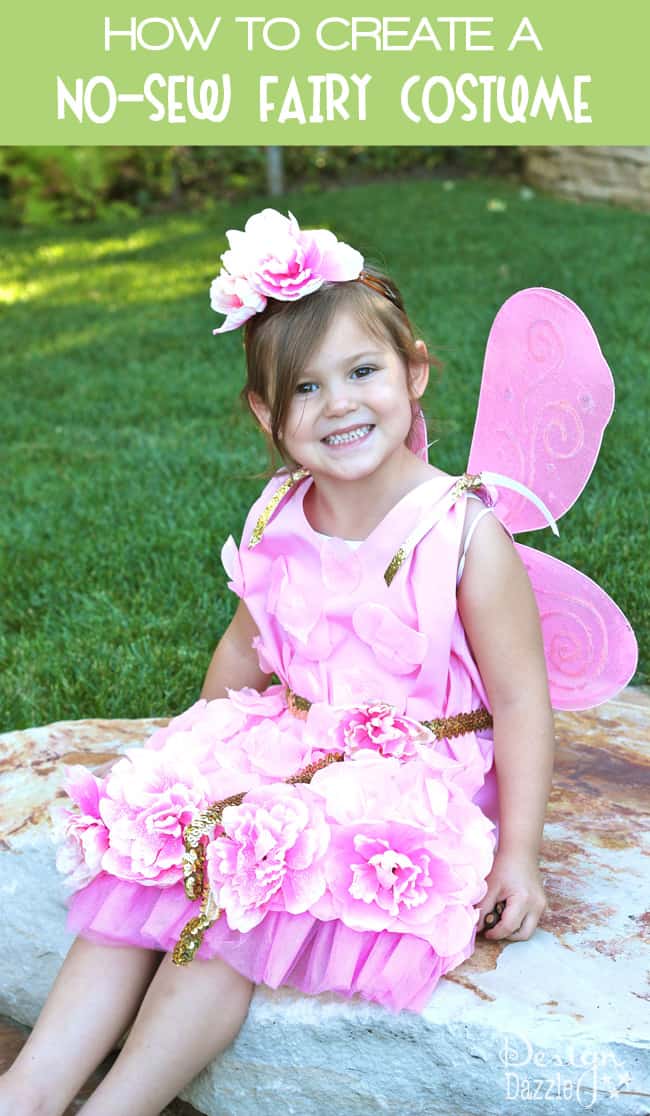 Can you believe this costume started as a pillowcase? Dollar store items were used to embellish this darling and inexpensive NO-SEW fairy costume! Design Dazzle #nosewcostume #fairycostume #pillowcasecostume #halloweencostume #nosewcostume