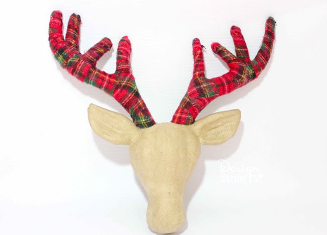 Adding plaid ribbon to the deer antlers gives it the perfect touch! Design Dazzle