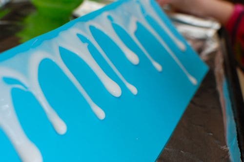 Create your own icicles with a little glue and salt for a fun indoor winter activity for kids!