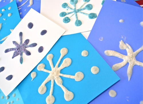 Puffy snowflake painting makes for a fun indoor winter craft for kids