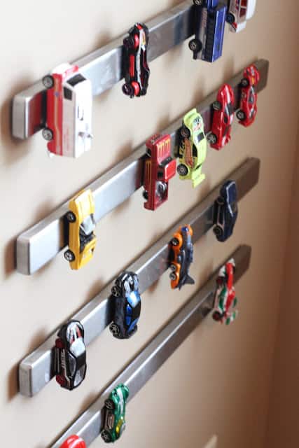 Magnetic knife holders from Ikea! Love this toy organization idea!