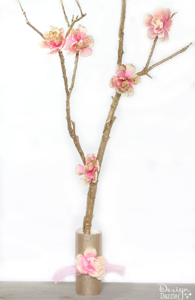 A glittered fairy branch is the perfect accessory for your fairy party! Make it on Design Dazzle.