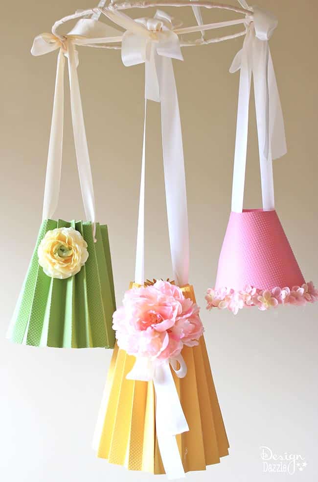 Make paper lampshades to hang on a sweet mobile! Tutorial on Design Dazzle.