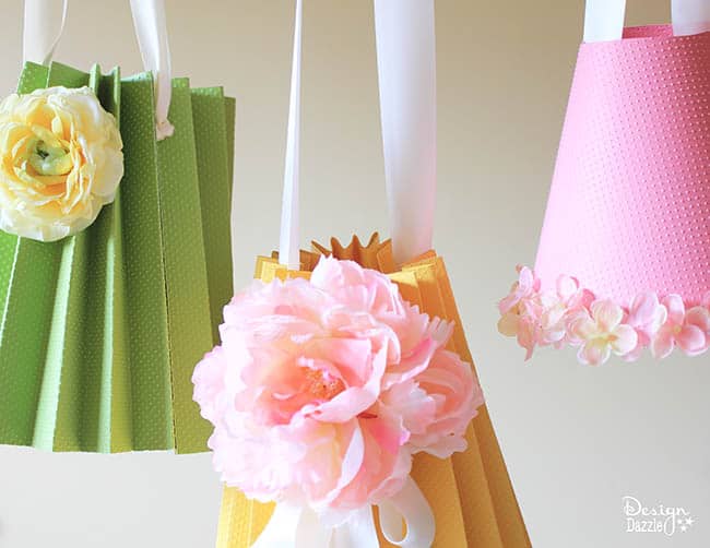 Make paper lampshades to hang on a sweet mobile! Tutorial on Design Dazzle.