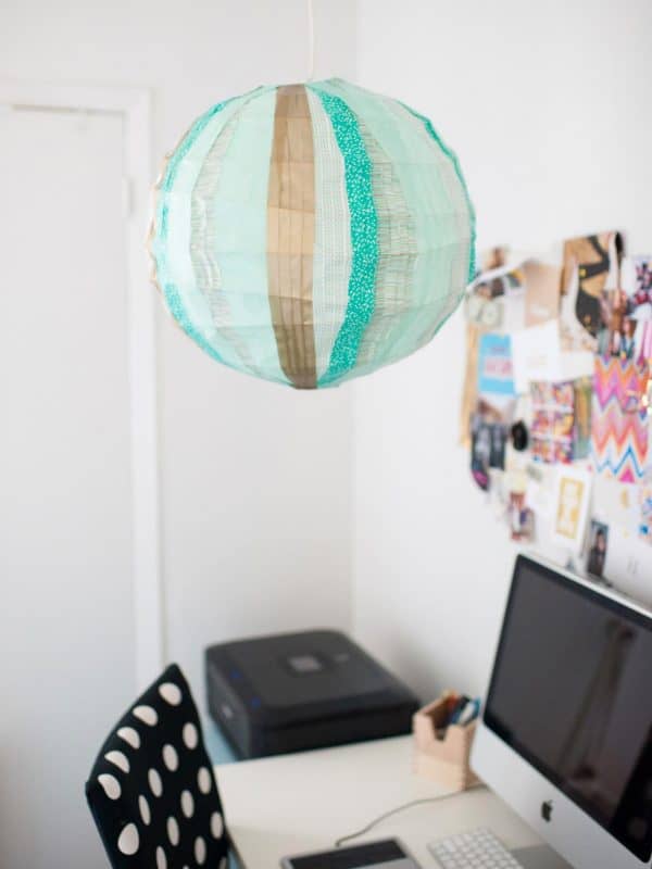 Use washi tape to create a unique paper lantern light for your dorm