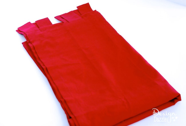 Red tab top curtains made into Santa Sacks (gift bags). Design Dazzle