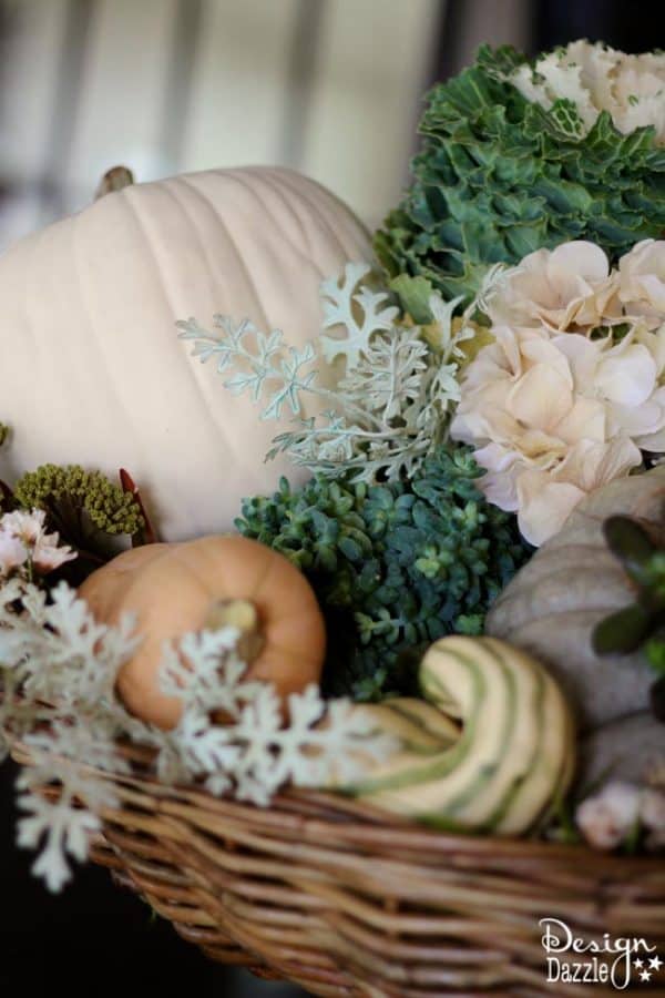 Succulents, ornamental cabbages, winter squash used with neutrals and a touch of glitz to create a stunning Thanksgiving tablescape. || thanksgiving decor | tablescape ideas for thanksgiving | decorating for fall | fall table decor | thanksgiving table decor || Design Dazzle #thanksgivingdecor #falltablescape #falltabledecor