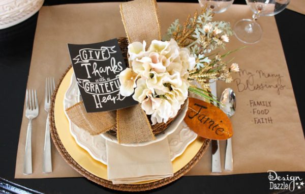 Succulents, ornamental cabbages, winter squash used with neutrals and a touch of glitz to create a stunning Thanksgiving tablescape. || thanksgiving decor | tablescape ideas for thanksgiving | decorating for fall | fall table decor | thanksgiving table decor || Design Dazzle #thanksgivingdecor #falltablescape #falltabledecor