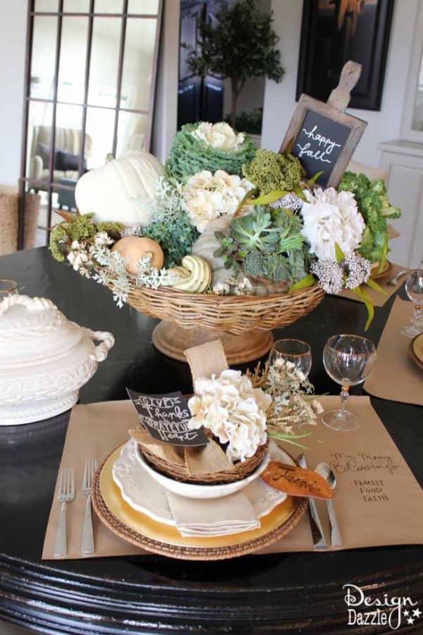 Succulents, ornamental cabbages, winter squash used with neutrals and a touch of glitz to create a stunning Thanksgiving tablescape. || thanksgiving decor | tablescape ideas for thanksgiving | decorating for fall | fall table decor | thanksgiving table decor || Design Dazzle #thanksgivingdecor #falltablescape #falltabledecor