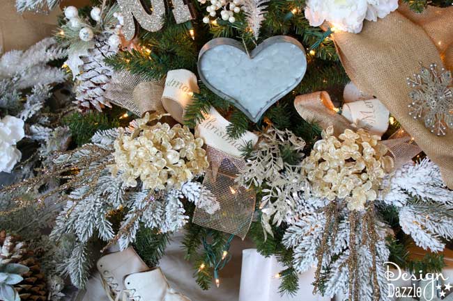 Winter Wonderland Glam Christmas Tree designed by Toni Roberts of Design Dazzle. Snow tipped branches, gold hydrangeas, white roses, lots of bling and touches of galvanized metal create this Winter Wonderland Glam Tree.