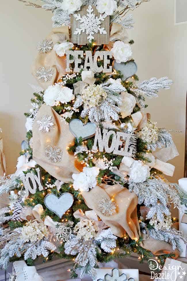 Winter Wonderland Glam Christmas Tree designed by Toni Roberts of Design Dazzle. Snow tipped branches, gold hydrangeas, white roses, lots of bling and touches of galvanized metal create this Winter Wonderland Glam Tree.