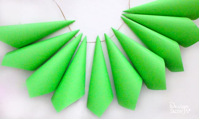 Create a whimsical Grinch paper cone Christmas tree! Design Dazzle shows you how.