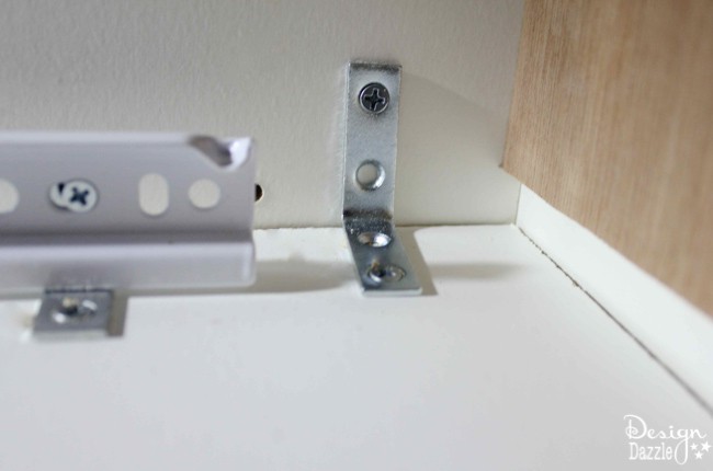 A quick solution to the best kitchen organization ever!! Solve a problem by installing pre-made kitchen slide-out shelves with a screwdriver. I love these shelves! Design Dazzle!