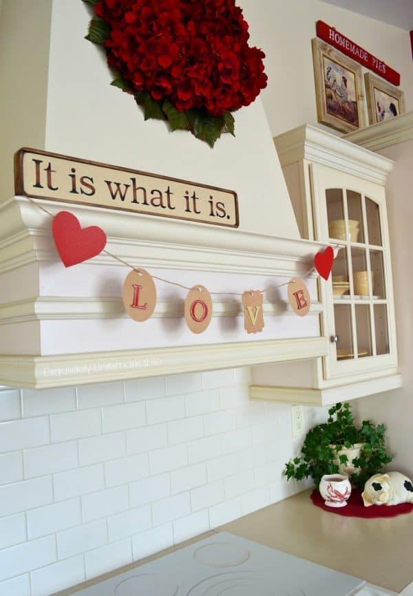 DIY Valentine LOVE Banner that is so cute hanging in this kitchen!