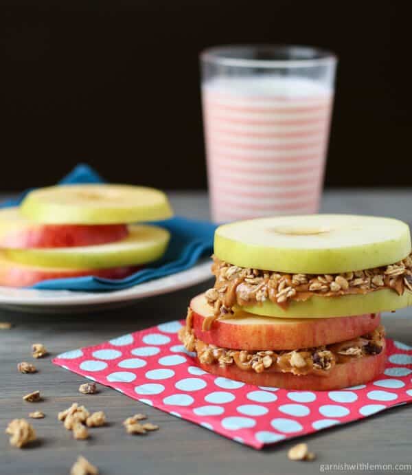 Apple Sandwiches with Peanut Butter and Granola. Perfect healthy snack for an afternoon pick me up!