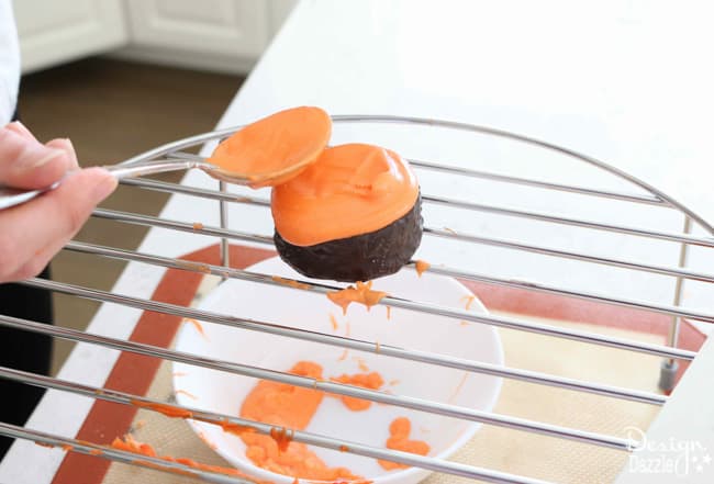 Easy Basketball Snack Cakes Made With Ding Dongs. Cute party idea for a absketball party or March Madness theme. Enjoy making with your family! Design Dazzle