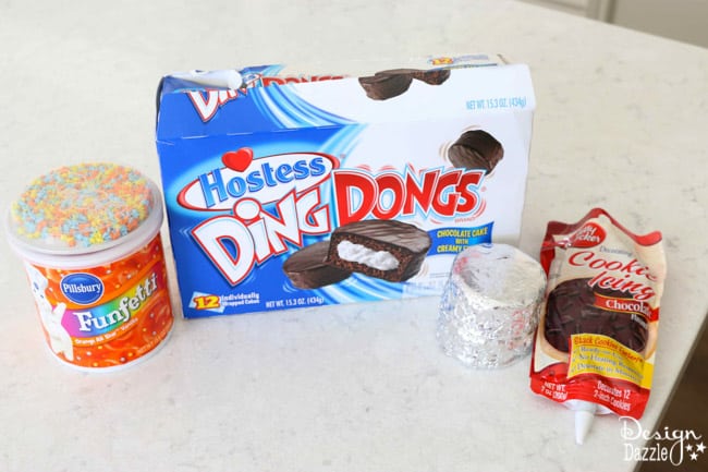 Easy Basketball Snack Cakes Made With Ding Dongs. Cute party idea for a absketball party or March Madness theme. Enjoy making with your family! Design Dazzle