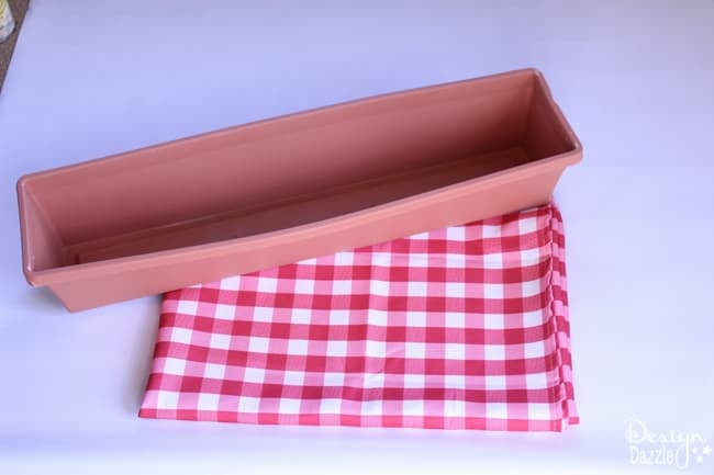 The no-sew diy valance made from a plastic window box. Use a glue gun and a table cloth to create a darling valance. Design Dazzle