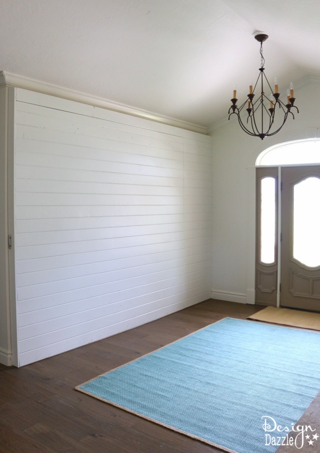 Entryway Room Makeover complete with sliding wall, "old" vintage doors and refurbished headboard/footboard bench | Design Dazzle