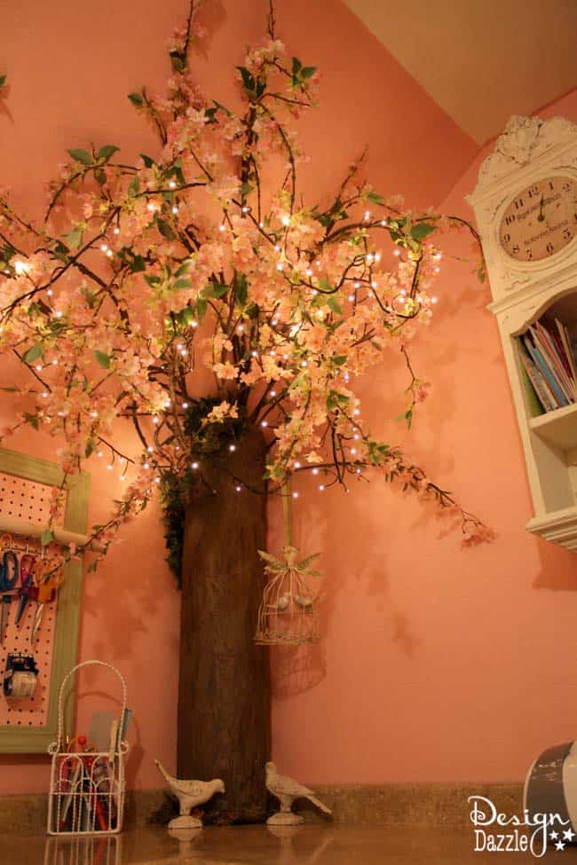 Craft room created using old kitchen cabinets. The tree with the blossom added just the right touch to my craft room. I loved turning on the fairy lights and crafting in there! Design Dazzle