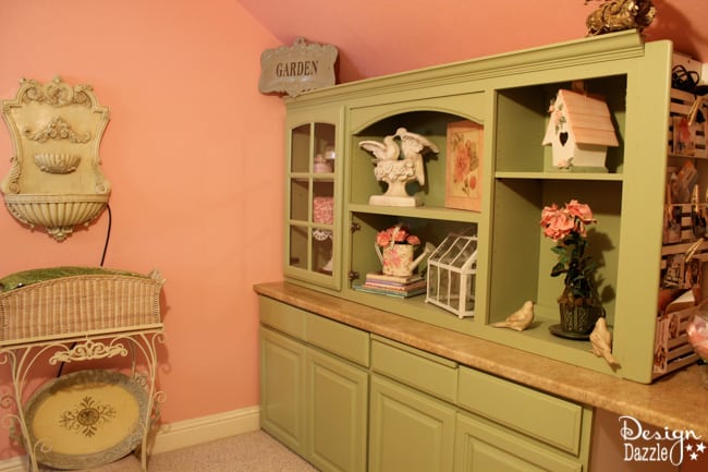 Craft room created using old kitchen cabinets. The tree with the blossom added just the right touch to my craft room. I loved turning on the fairy lights and crafting in there! Design Dazzle