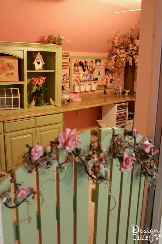 Craft room created using old kitchen cabinets. The tree with the blossom added just the right touch to my craft room. I loved turning on the fairy lights and crafting in there! Design Dazzle