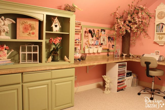 Craft room created using old kitchen cabinets. The tree with the blossom added just the right touch to my craft room. I loved turning on the fairy lights and crafting in there! Design Dazzle