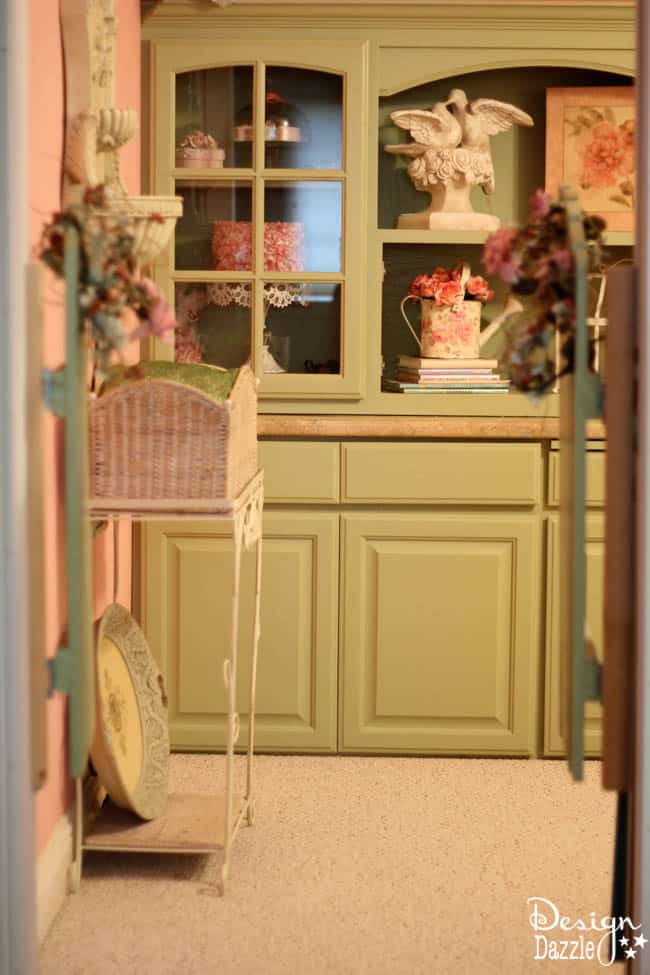 Craft room created using old kitchen cabinets. The tree with the blossom added just the right touch to my craft room. I loved turning on the fairy lights and crafting in there! Design Dazzle