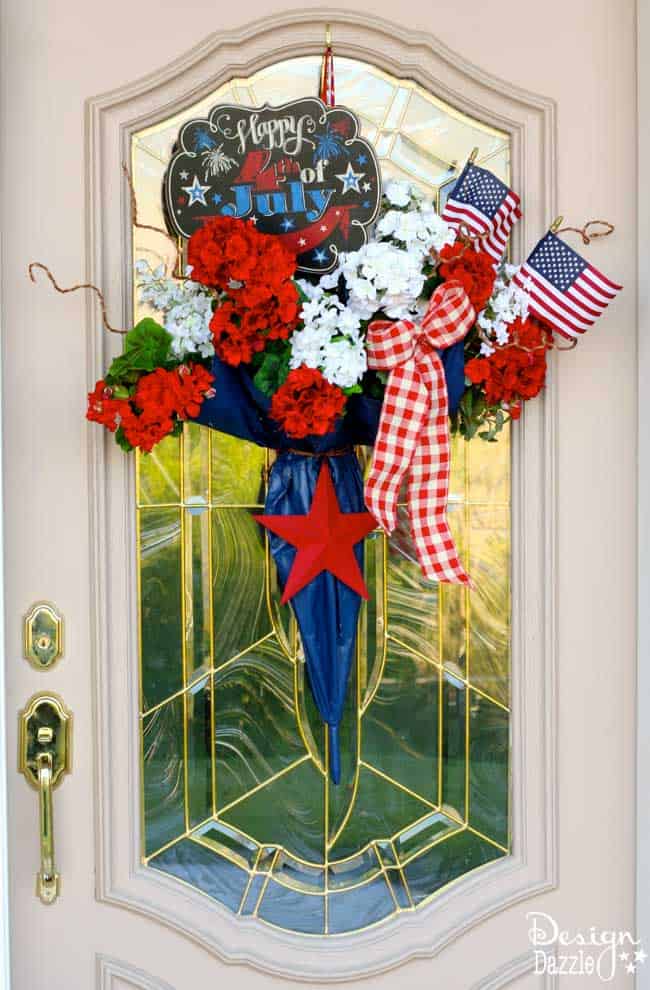 I took an old umbrella and re-purposed it into a fun and festive Umbrella 4th of July Door Decor that makes a great welcome door hanger. | Design Dazzle