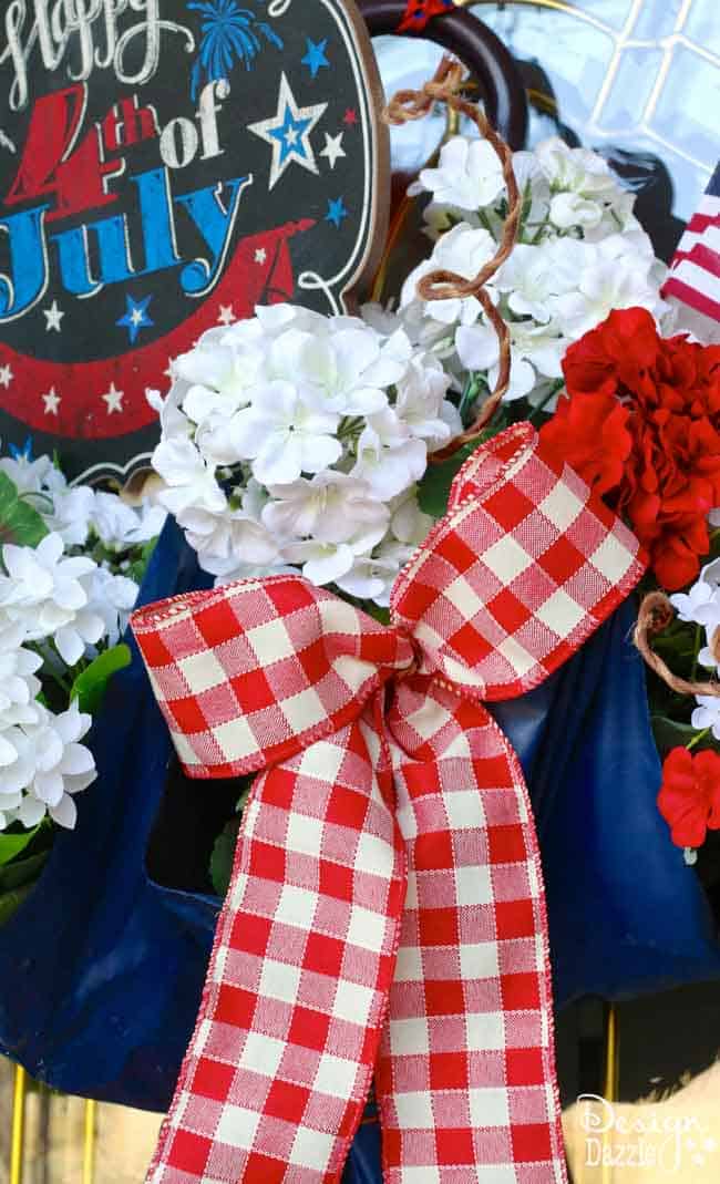 I took an old umbrella and re-purposed it into a fun and festive Umbrella 4th of July Door Decor that makes a great welcome door hanger. | Design Dazzle