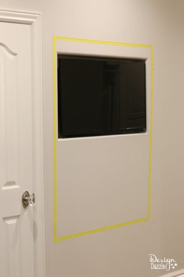 Create a sliding chalkboard or wall art to hide a hidden kitchen TV