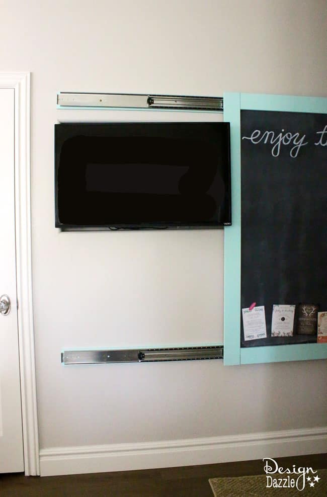 This magnetic chalkboard slides to reveal the hidden kitchen TV. | Design Dazzle