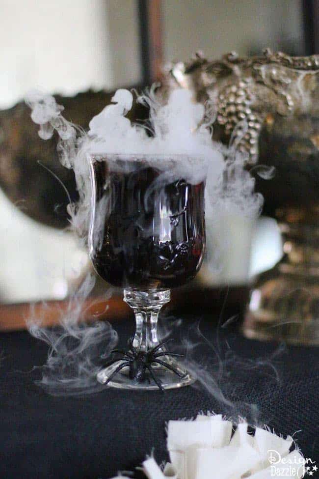 Spooky Halloween Drink Recipe with dry ice! Delicious and easy, nonalcoholic punch that is perfect for your next Halloween Party! #halloween #halloweendrinks #spooky || designdazzle.com