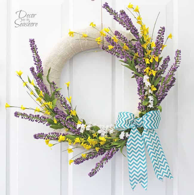 All 13 of these spectacular spring wreaths are simple to create, fun, creative, and will leave you with a gorgeous looking front door! | Design Dazzle