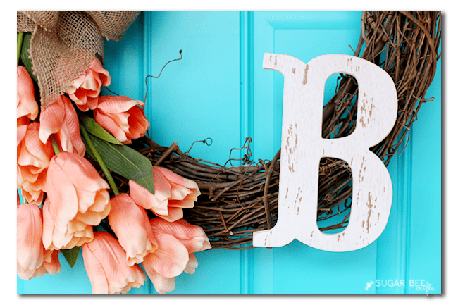 All 13 of these spectacular spring wreaths are simple to create, fun, creative, and will leave you with a gorgeous looking front door! | Design Dazzle