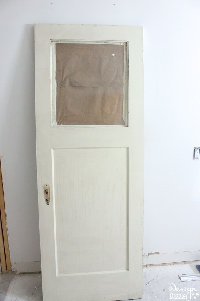 This post shows how to create a swing door out of a regular door and a convenient pull out ironing board in my Laundry Pantry Room combo! | Design Dazzle