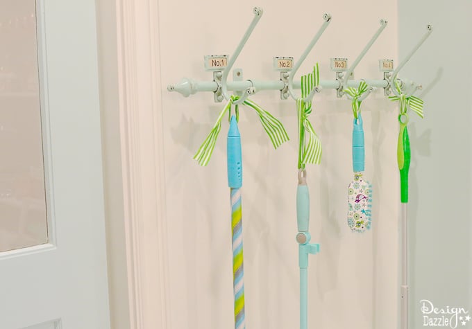 This post shows how to create a swing door out of a regular door and a convenient pull out ironing board in my Laundry Pantry Room combo! | Design Dazzle