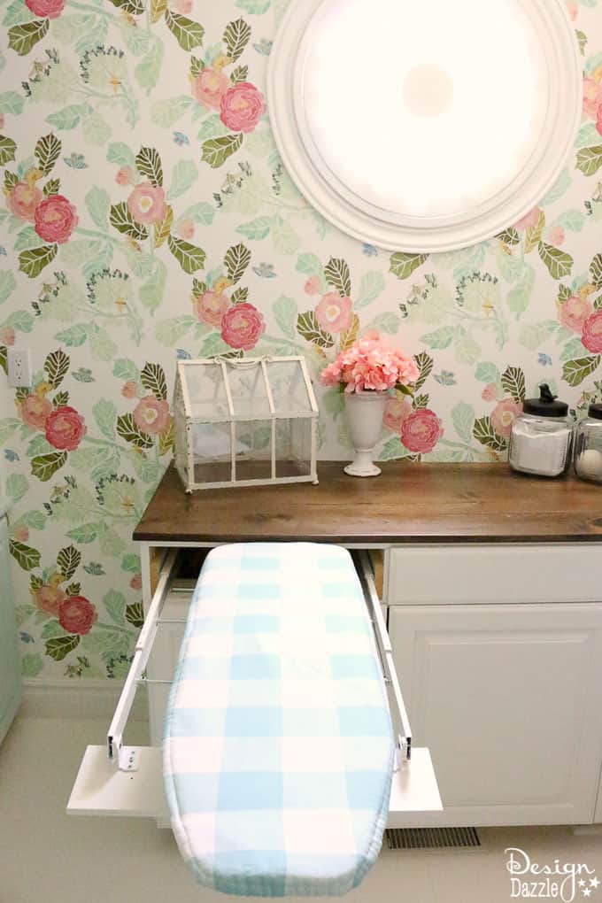 This post shows how to create a swing door out of a regular door and a convenient pull out ironing board in my Laundry Pantry Room combo! | Design Dazzle