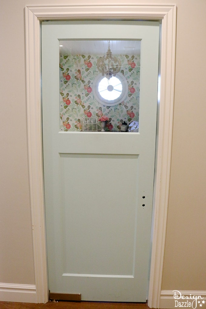 This post shows how to create a swing door out of a regular door and a convenient pull out ironing board in my Laundry Pantry Room combo! | Design Dazzle