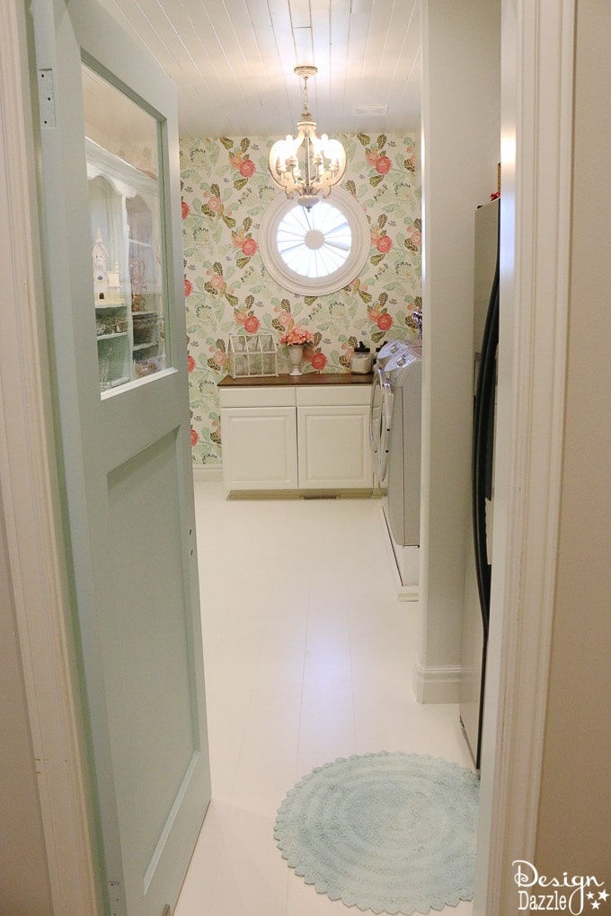 This post shows how to create a swing door out of a regular door and a convenient pull out ironing board in my Laundry Pantry Room combo! | Design Dazzle